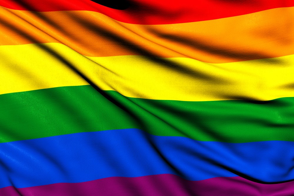 Colourful gay pride flag waving